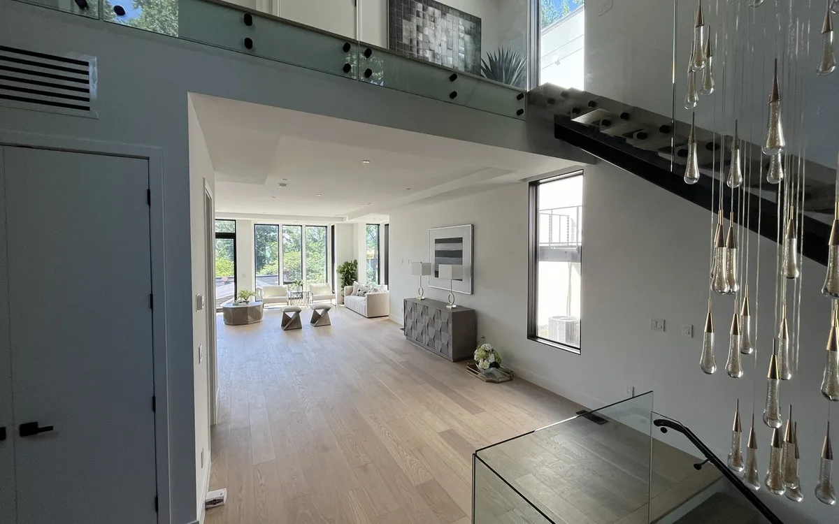 Large-format porcelain tile flooring installed in a bright open-plan kitchen and dining area in a Northern Virginia home