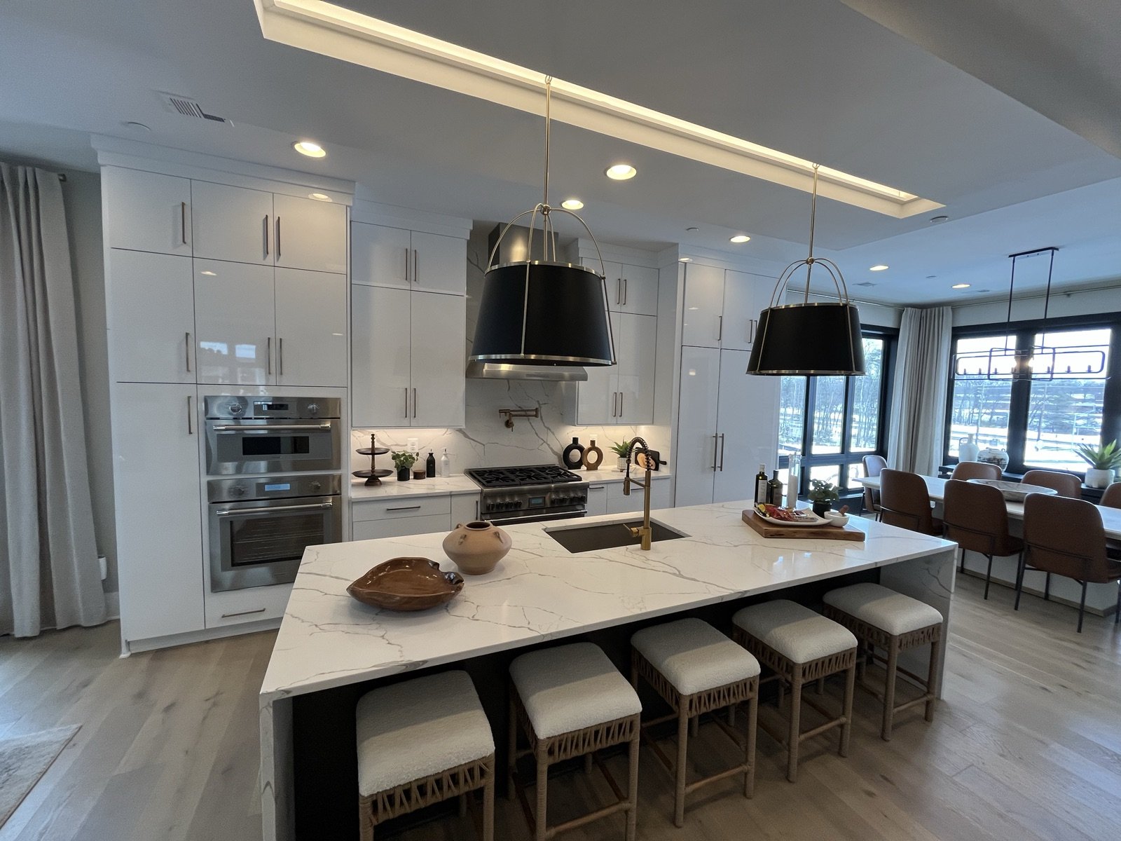 Custom kitchen remodel with marble waterfall island by Donya LLC