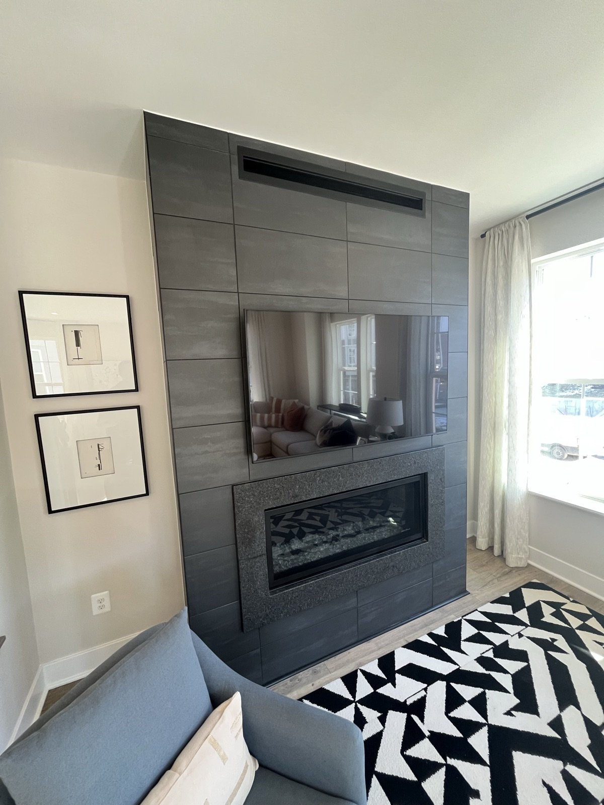 Finished living space with fireplace by Donya LLC
