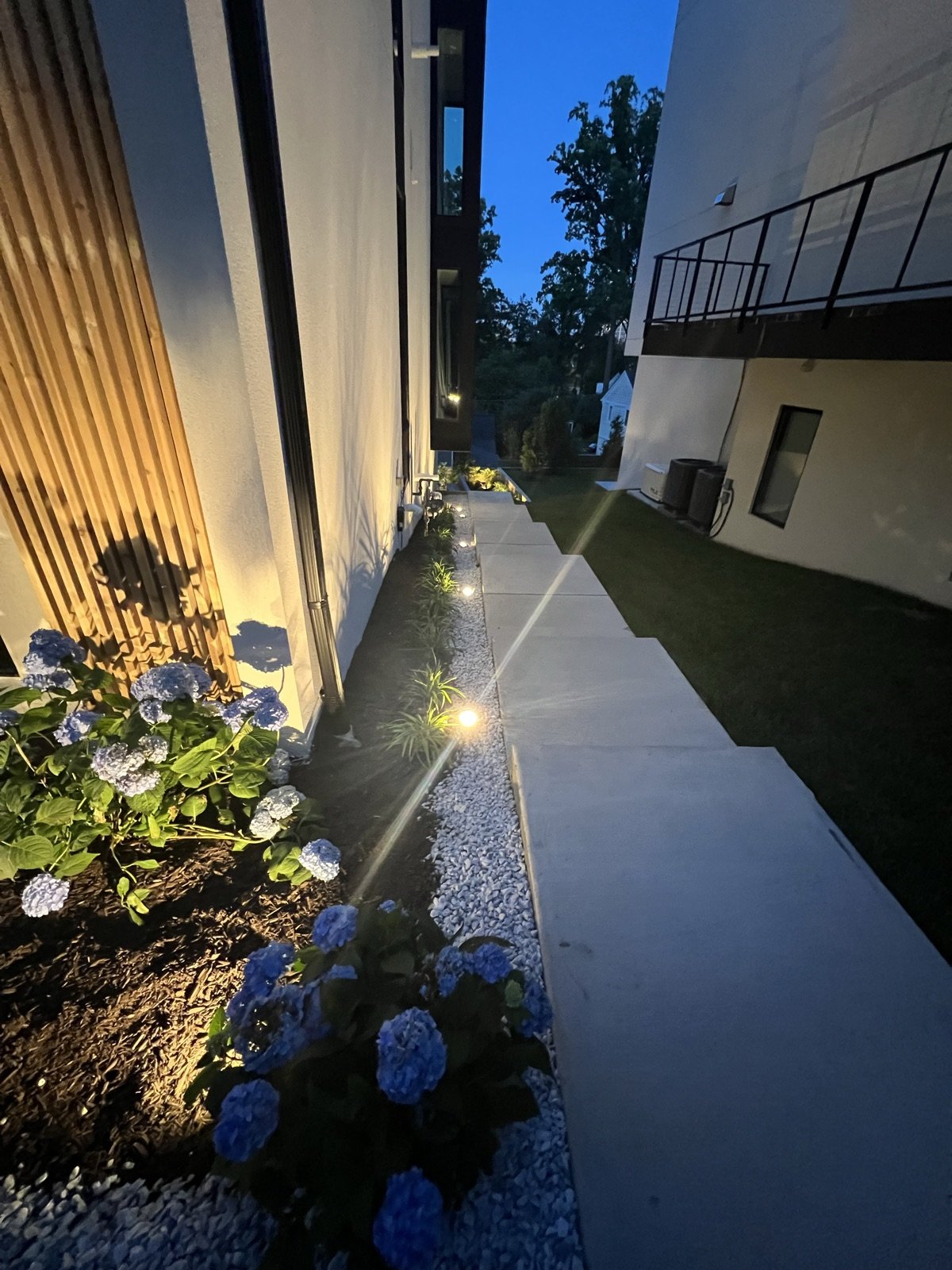 Evening landscape and outdoor lighting by Donya LLC